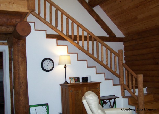 Interior Timber Staircase and Log Railing in Two Level Log Home