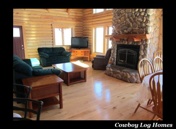 great room and fireplace of log home