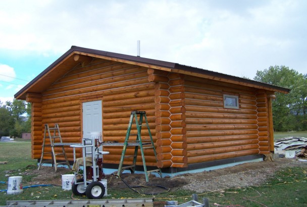 Swedish Cope Mountain Cabin with Hunter Green Door and Metal Clad Windows