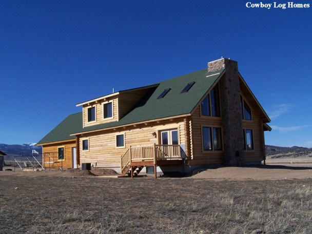 Log Home Being Stained