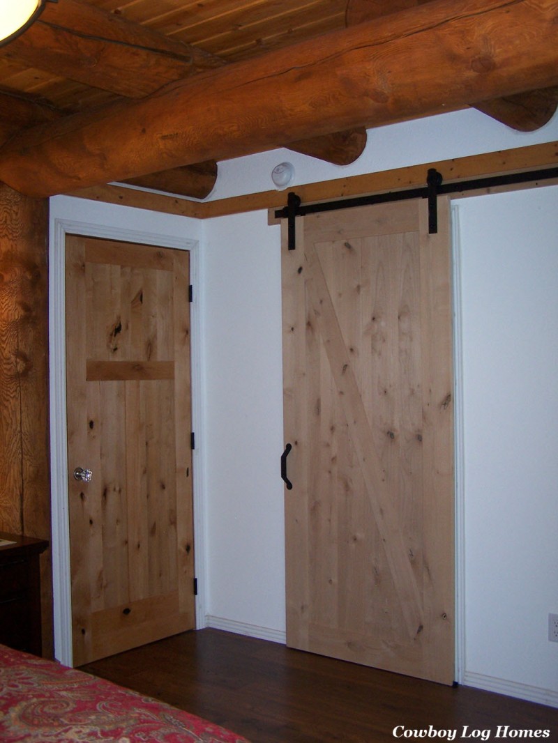 Alder Doors in Log Home Master Bedroom | Cowboy Log Homes