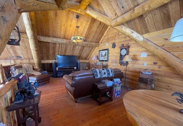 Loft with Handcrafted Log Roof System