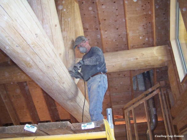 Hand Buffing Handcrafted Log Roof System