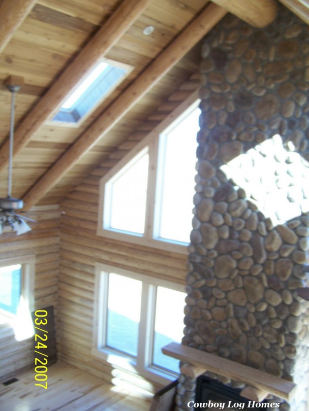 Great Room of Log Home with Full Stone Fireplace