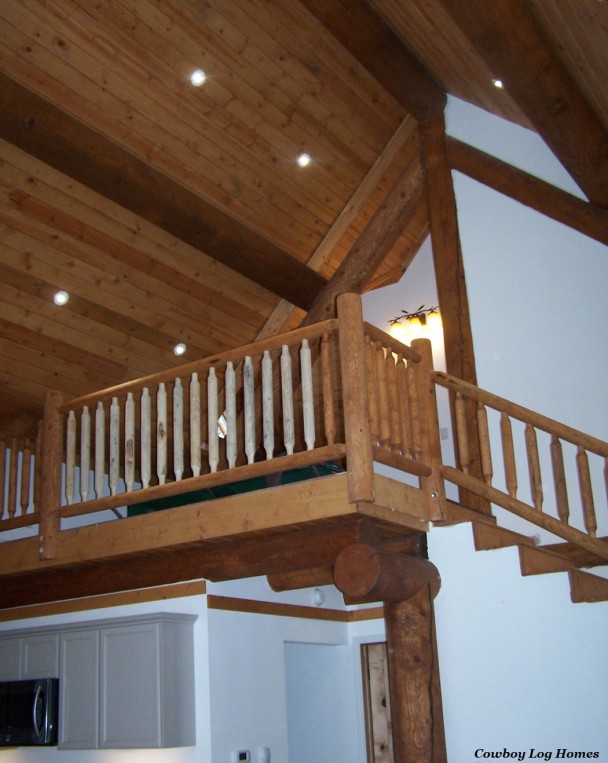 Loft with Milled Log Railing and Pine Ceiling