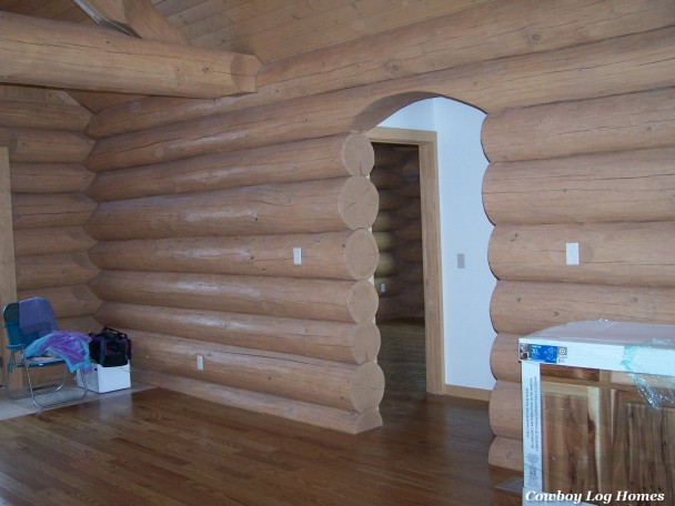 log archway in handcrafted log home