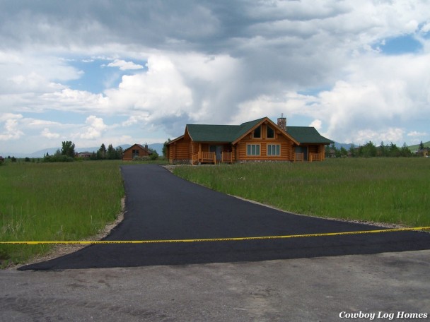 handcrafted log homes paved driveway